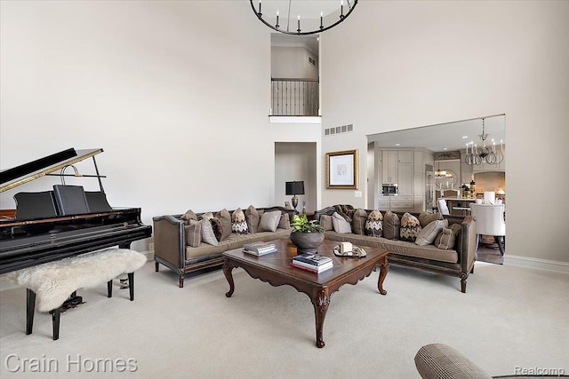 49729 Sandra Dr, Shelby Twp, MI 48315 - carpeted living room with a chandelier, baseboards, and a towering ceiling