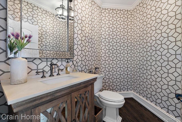 49729 Sandra Dr, Shelby Twp, MI 48315 - bathroom with ornamental molding, vanity, toilet, wood finished floors, and backsplash