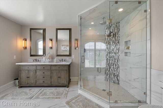 49729 Sandra Dr, Shelby Twp, MI 48315 - full bath with marble finish floors, a shower stall, double vanity, baseboards, and healthy amount of natural light