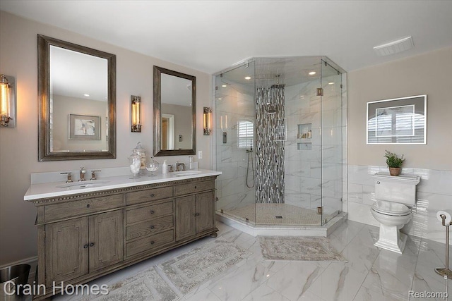 49729 Sandra Dr, Shelby Twp, MI 48315 - full bathroom featuring double vanity, a shower stall, toilet, and marble finish flooring