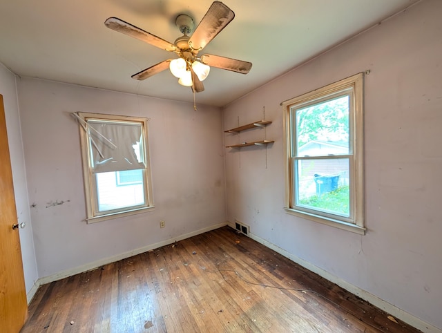 24573 Stewart Ave, Warren, MI 48089 - empty room featuring wood-type flooring, baseboards, and a ceiling fan