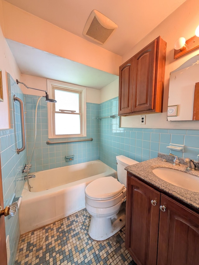24573 Stewart Ave, Warren, MI 48089 - full bathroom featuring tile walls, vanity, tile patterned flooring, toilet, and shower / bath combination
