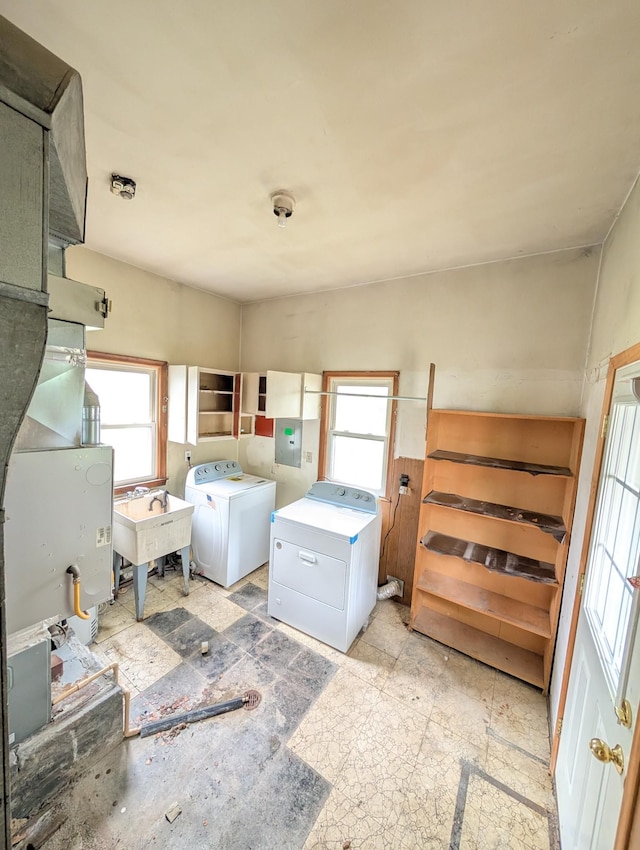 24573 Stewart Ave, Warren, MI 48089 - washroom featuring separate washer and dryer, healthy amount of natural light, and electric panel