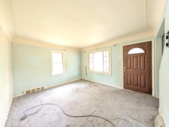 24573 Stewart Ave, Warren, MI 48089 - carpeted foyer featuring plenty of natural light and baseboards