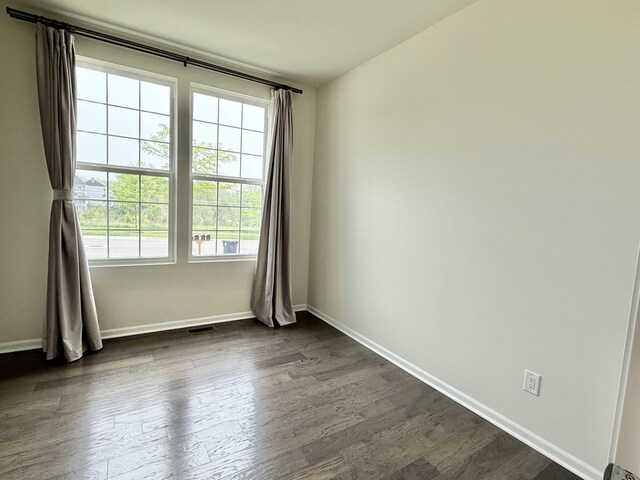 2763 Polson St, Ann Arbor, MI 48105 - spare room with baseboards and dark wood-style floors