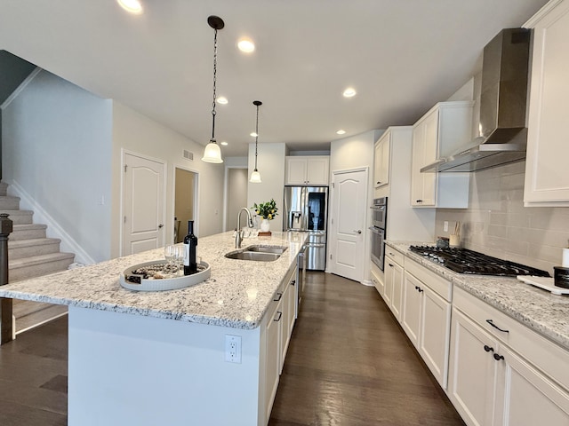 2763 Polson St, Ann Arbor, MI 48105 - kitchen with a sink, wall chimney range hood, stainless steel appliances, dark wood finished floors, and white cabinetry