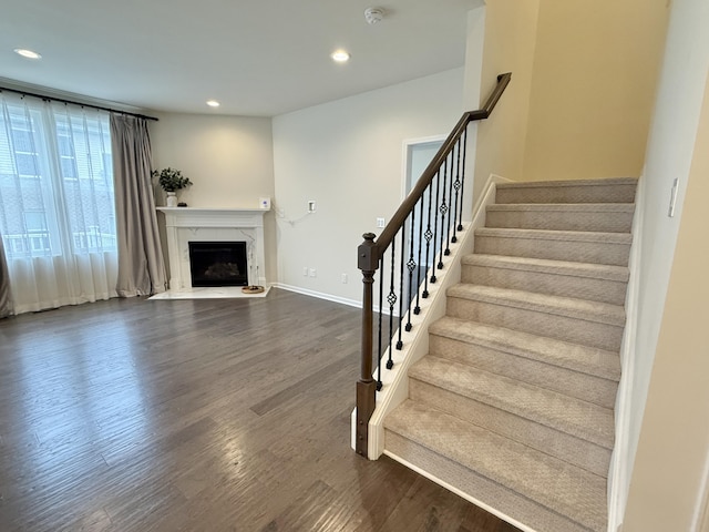 2763 Polson St, Ann Arbor, MI 48105 - stairway featuring wood finished floors, recessed lighting, a high end fireplace, and baseboards