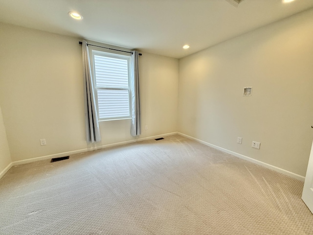 2763 Polson St, Ann Arbor, MI 48105 - spare room featuring light carpet, baseboards, and recessed lighting