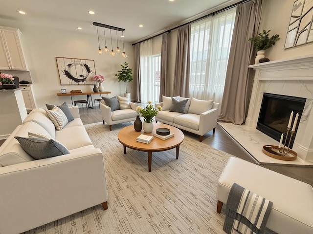 2763 Polson St, Ann Arbor, MI 48105 - living area with light wood-style floors, recessed lighting, and a fireplace