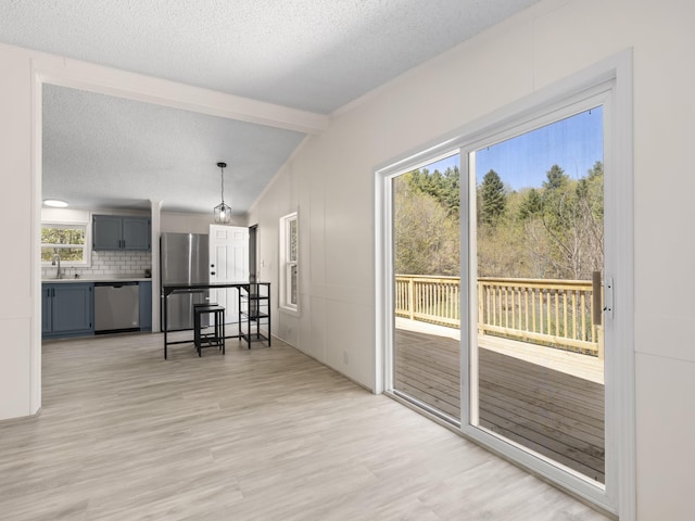 2906 Frankfort Hwy, Frankfort, MI 49635 - living room featuring light wood-style flooring and a textured ceiling