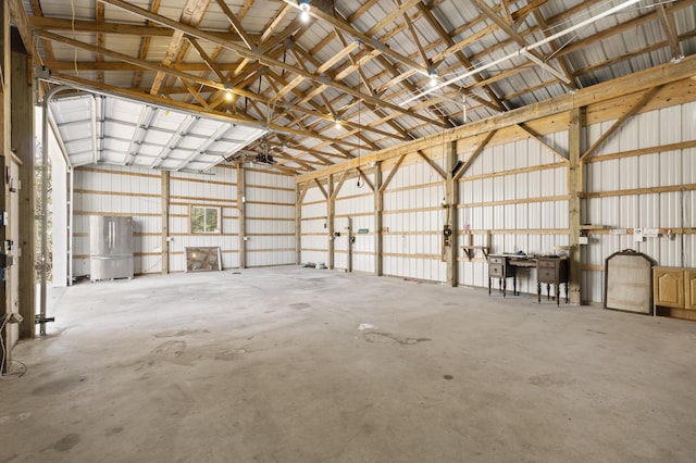 2906 Frankfort Hwy, Frankfort, MI 49635 - garage featuring metal wall and freestanding refrigerator