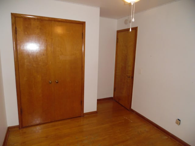 614 Allcott St, Marshall, MI 49068 - unfurnished bedroom featuring light wood-style floors, baseboards, and a closet