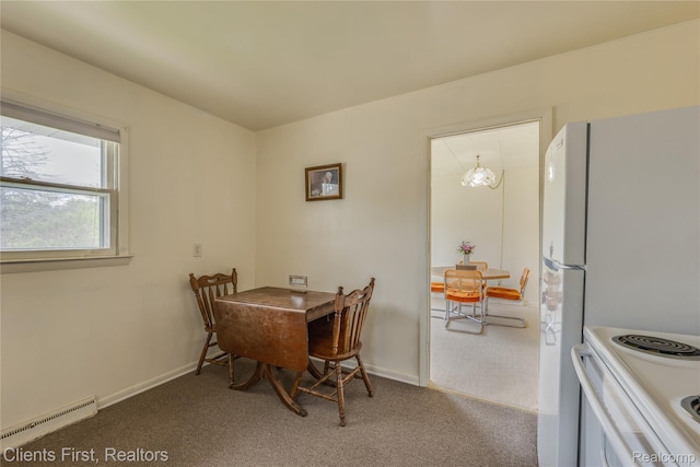 631 Lindsay St, West Branch, MI 48661 - carpeted dining room featuring baseboard heating and baseboards