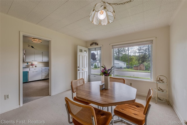 631 Lindsay St, West Branch, MI 48661 - dining area with light colored carpet and baseboards