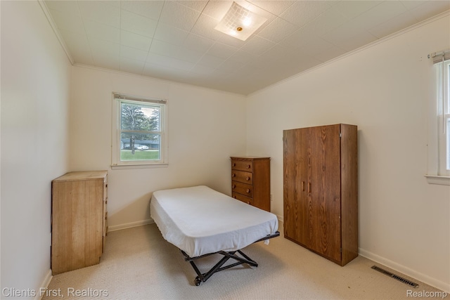 631 Lindsay St, West Branch, MI 48661 - bedroom featuring ornamental molding, light carpet, and baseboards