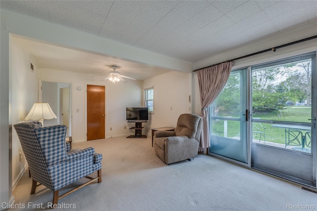 631 Lindsay St, West Branch, MI 48661 - carpeted living area featuring healthy amount of natural light and a ceiling fan