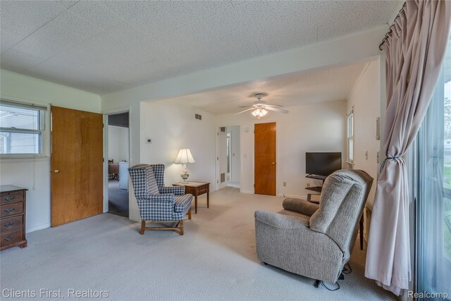 631 Lindsay St, West Branch, MI 48661 - living room featuring carpet flooring and a ceiling fan