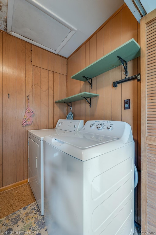 631 Lindsay St, West Branch, MI 48661 - washroom with washing machine and clothes dryer and wood walls