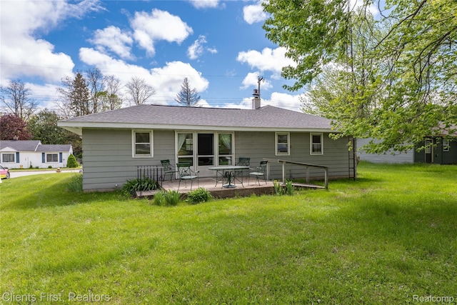 631 Lindsay St, West Branch, MI 48661 - back of house with a yard, a patio area, and a shingled roof
