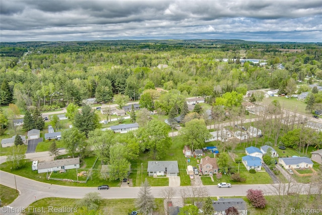 631 Lindsay St, West Branch, MI 48661 - aerial view of property and surrounding area featuring a forest and nearby suburban area