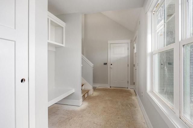 9383 Shimano Dr, Portland, MI 48875 - mudroom with carpet flooring, baseboards, and vaulted ceiling