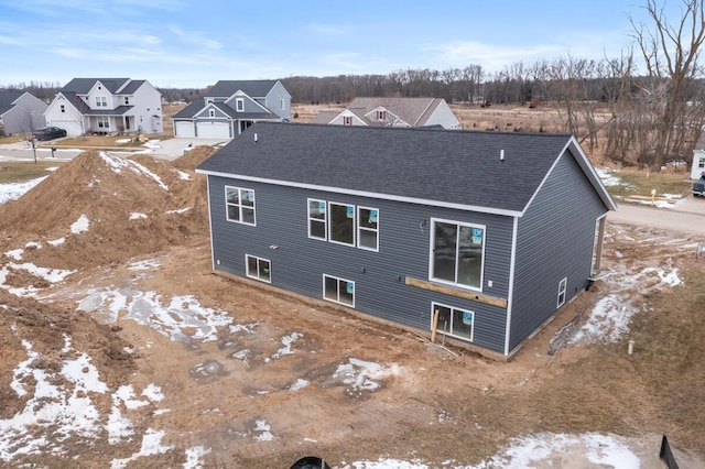 9383 Shimano Dr, Portland, MI 48875 - back of property featuring a residential view and a shingled roof