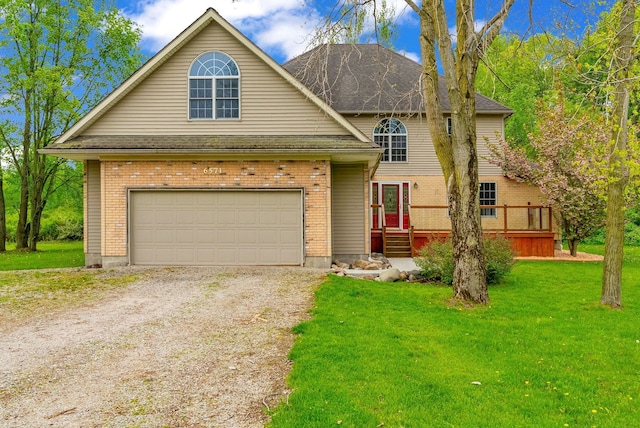 traditional home featuring driveway, a garage, a front lawn, and brick siding