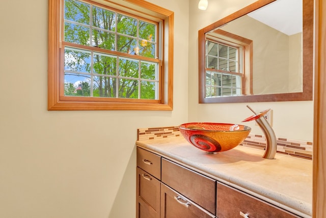 bathroom with plenty of natural light and vanity