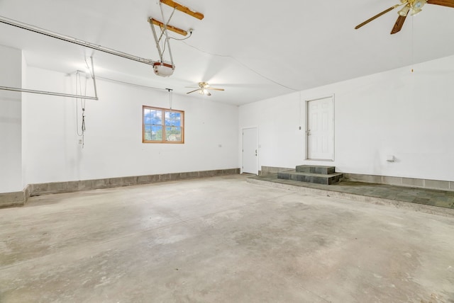 garage with a ceiling fan and a garage door opener