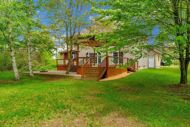 back of property featuring a deck and a yard