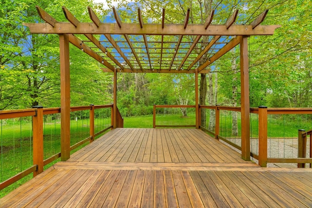 wooden deck featuring a pergola and a yard
