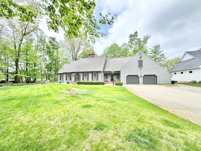 4909 Barnstable Ln, Lansing, MI 48906 - view of front of property featuring concrete driveway, a chimney, a front lawn, and roof with shingles