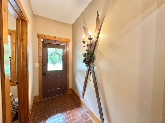 4909 Barnstable Ln, Lansing, MI 48906 - foyer entrance with brick floors and baseboards