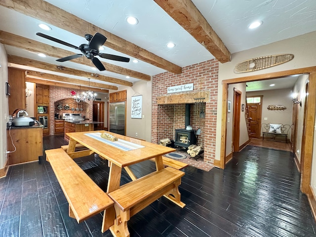 4909 Barnstable Ln, Lansing, MI 48906 - dining space with a wood stove, dark wood finished floors, ceiling fan, beamed ceiling, and a chandelier