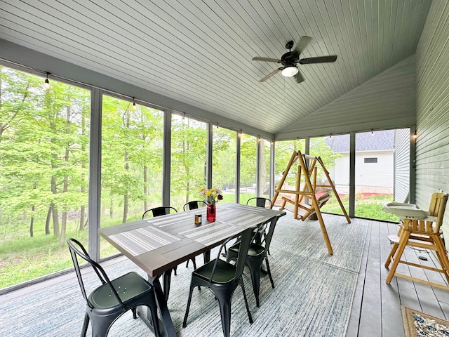 4909 Barnstable Ln, Lansing, MI 48906 - sunroom with ceiling fan, vaulted ceiling, and outdoor dining area