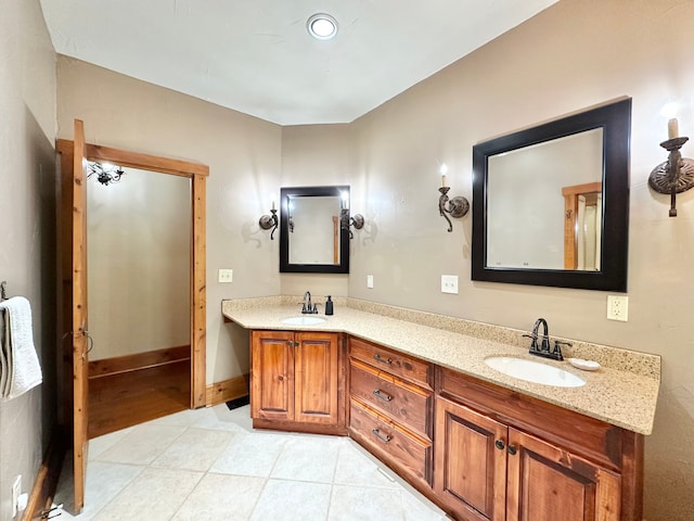 4909 Barnstable Ln, Lansing, MI 48906 - bathroom featuring double vanity and tile patterned flooring