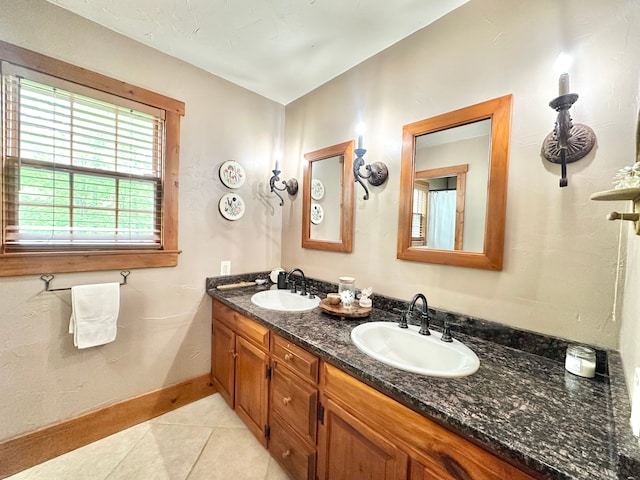 4909 Barnstable Ln, Lansing, MI 48906 - full bath with double vanity and tile patterned flooring