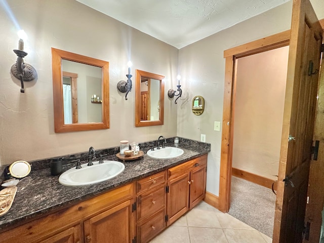 4909 Barnstable Ln, Lansing, MI 48906 - bathroom featuring double vanity and tile patterned flooring