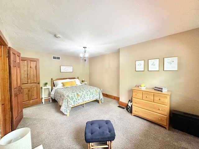4909 Barnstable Ln, Lansing, MI 48906 - carpeted bedroom featuring baseboards and a chandelier