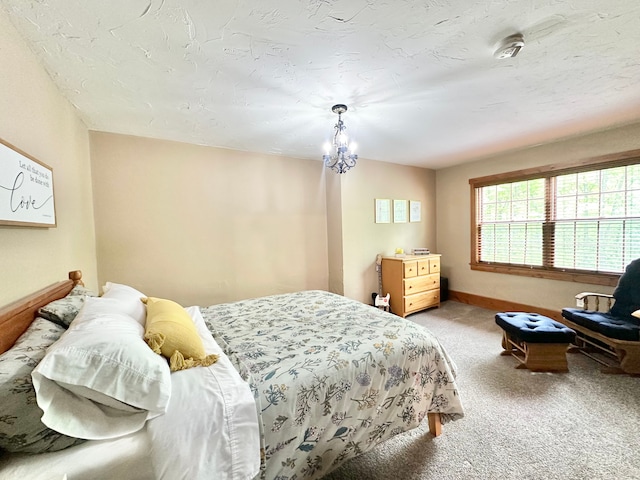4909 Barnstable Ln, Lansing, MI 48906 - bedroom with carpet and a chandelier