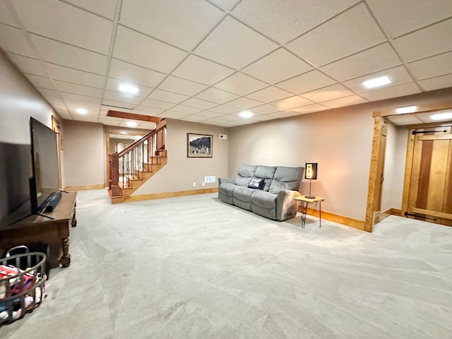 4909 Barnstable Ln, Lansing, MI 48906 - unfurnished living room featuring carpet floors, stairway, and a paneled ceiling