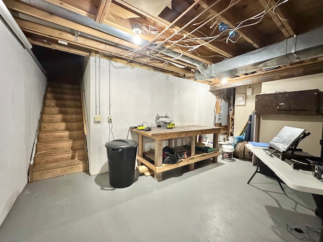 4909 Barnstable Ln, Lansing, MI 48906 - unfinished basement featuring a workshop area and stairway