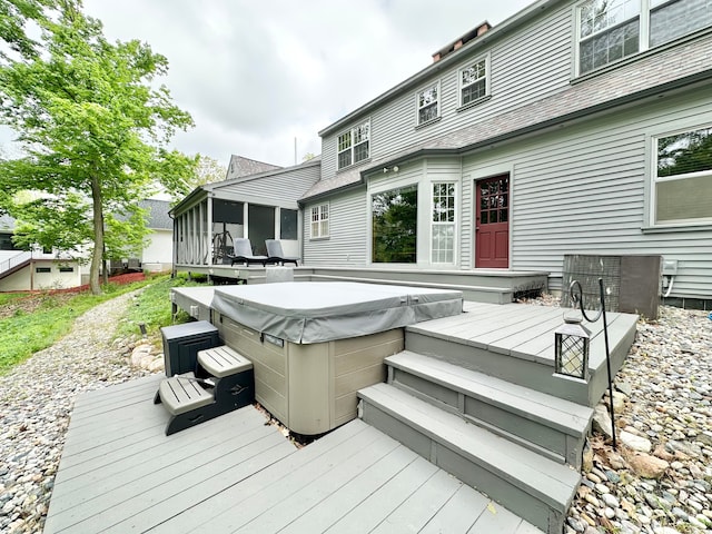 4909 Barnstable Ln, Lansing, MI 48906 - wooden terrace featuring a hot tub and a sunroom