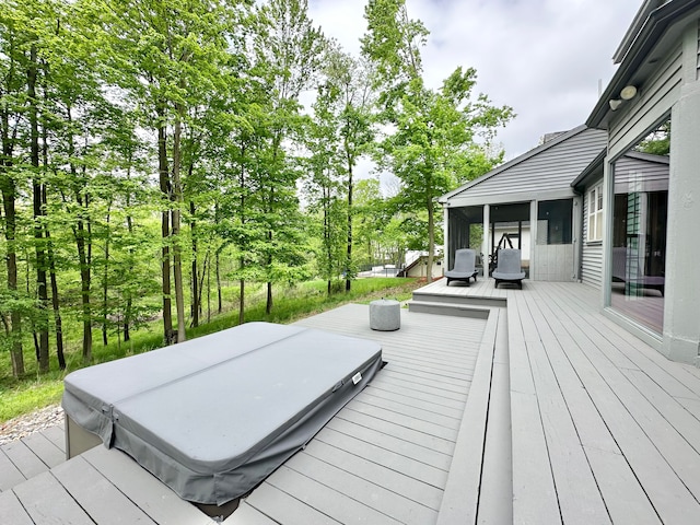 4909 Barnstable Ln, Lansing, MI 48906 - wooden deck featuring a covered hot tub and a sunroom