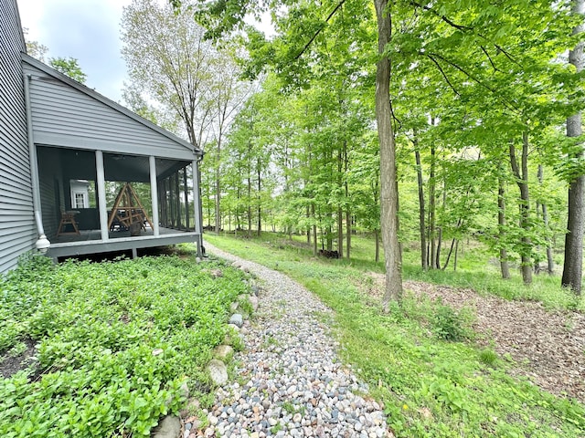 4909 Barnstable Ln, Lansing, MI 48906 - view of yard featuring a sunroom