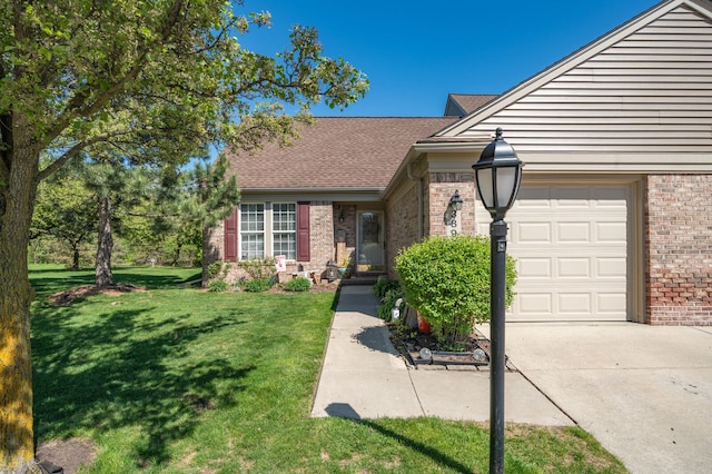 3897 Hunters Way, Canton, MI 48188 - view of front of house featuring brick siding, a garage, a front yard, and concrete driveway