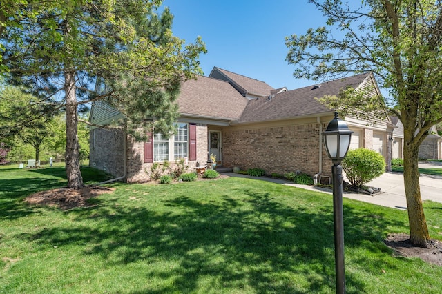 3897 Hunters Way, Canton, MI 48188 - ranch-style home with brick siding, an attached garage, a front yard, and concrete driveway