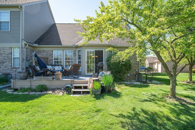 3897 Hunters Way, Canton, MI 48188 - rear view of property with a yard, a wooden deck, brick siding, and roof with shingles