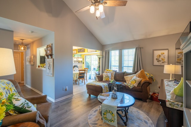 3897 Hunters Way, Canton, MI 48188 - living room featuring a ceiling fan, wood finished floors, baseboards, and high vaulted ceiling