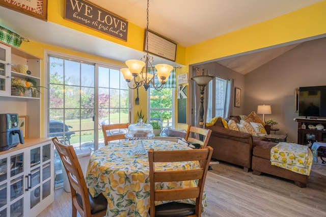 3897 Hunters Way, Canton, MI 48188 - dining area with lofted ceiling, wood finished floors, and a chandelier